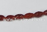 CAA124 15.5 inches 6*10mm faceted rice red agate gemstone beads