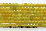 CAA6276 15 inches 4mm round yellow fire agate beads