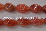 CAG4184 15.5 inches 6*10mm twisted rice natural fire agate beads