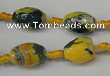 CAG5774 15 inches 10*14mm faceted rice fire crackle agate beads