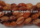 CAG599 15.5 inches 10*14mm faceted rice natural fire agate beads