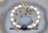 CFB980 Hand-knotted 9mm - 10mm rice white freshwater pearl & blue tiger eye bracelet