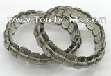 CGB3463 7.5 inches 10*14mm faceted oval smoky quartz bracelets