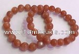 CGB4540 7.5 inches 10mm - 11mm round golden sunstone beaded bracelets