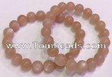 CGB4588 7.5 inches 10mm - 11mm round sunstone beaded bracelets