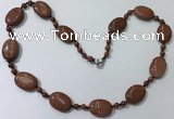 CGN201 22 inches 6mm round & 18*25mm oval goldstone necklaces