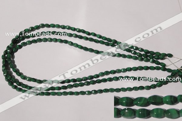 CMN222 15.5 inches 4*6mm faceted rice natural malachite beads