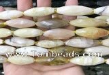 CRI143 15.5 inches 10*30mm faceted rice yellow opal gemstone beads