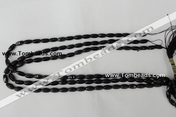 CTO116 15.5 inches 5*10mm faceted rice black tourmaline beads