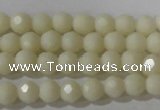 CTU1440 15.5 inches 4mm faceted round synthetic turquoise beads